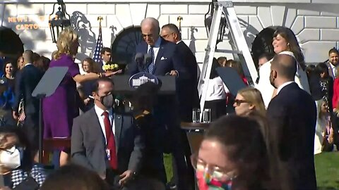 Biden tries to talk into microphone while music is blasting, Jill stops him, nobody cares.