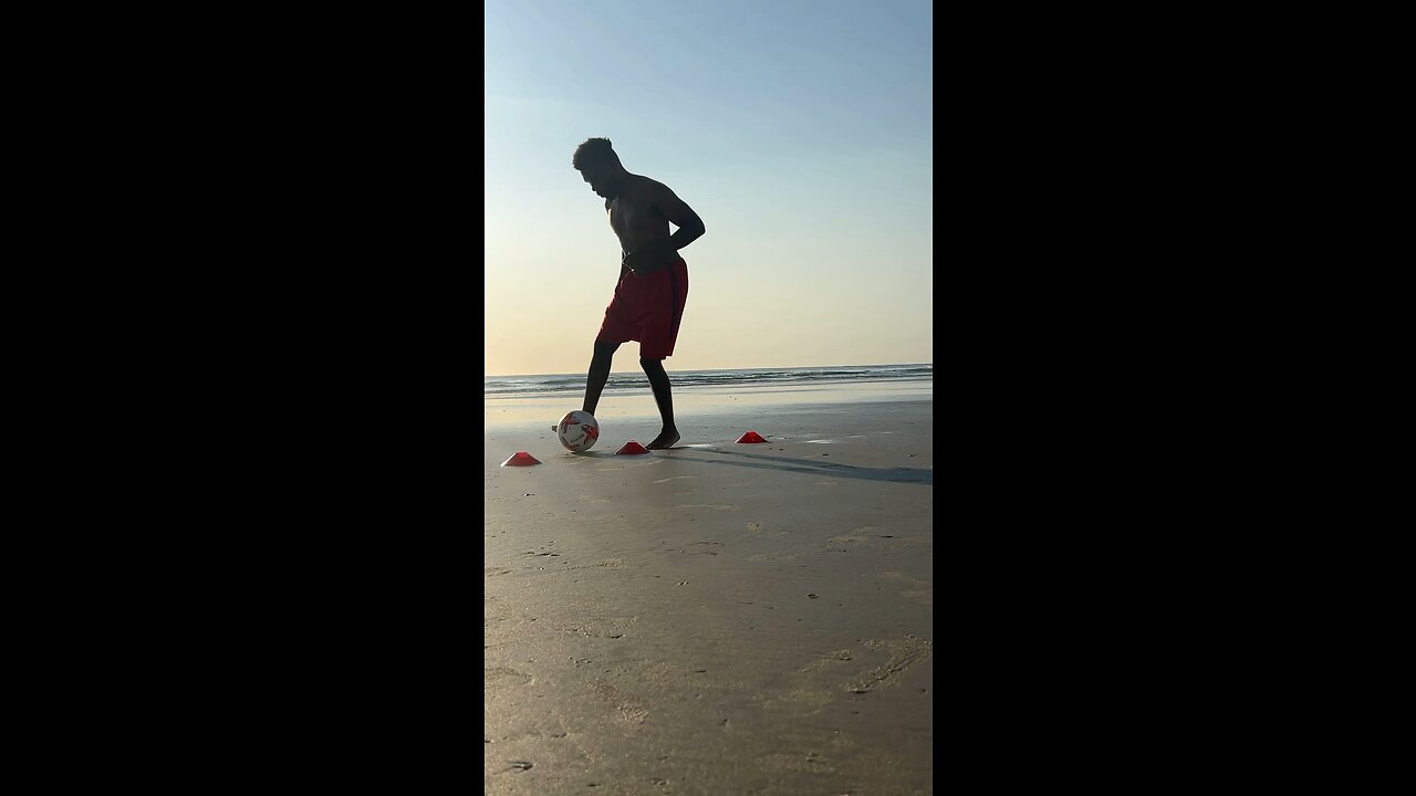 Dribbling soccer drill on the beach