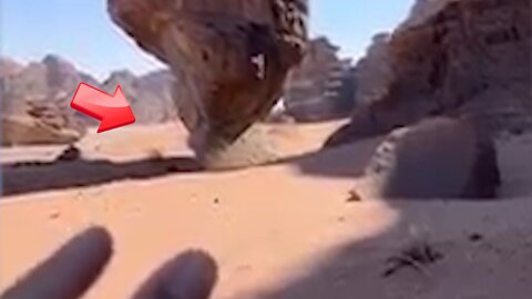 A large rock defying gravity that seems to fall down but doesn't [Mysterious]