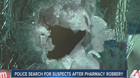 Police search for suspects after pharmacy robbery