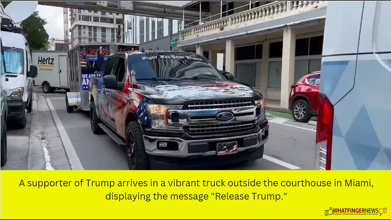 A supporter of Trump arrives in a vibrant truck outside the courthouse in Miami