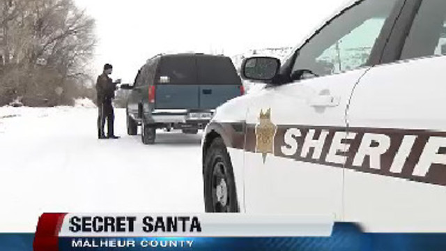 Malhuer County Sheriff Deputies hand out cash thanks to Secret Santa
