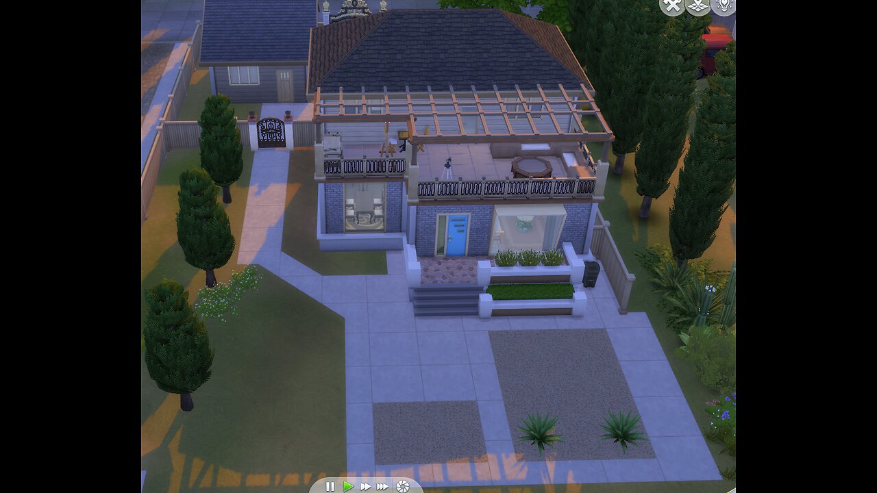 Working on two different houses in the Sims 4