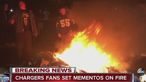 Chargers fans set mementos on fire