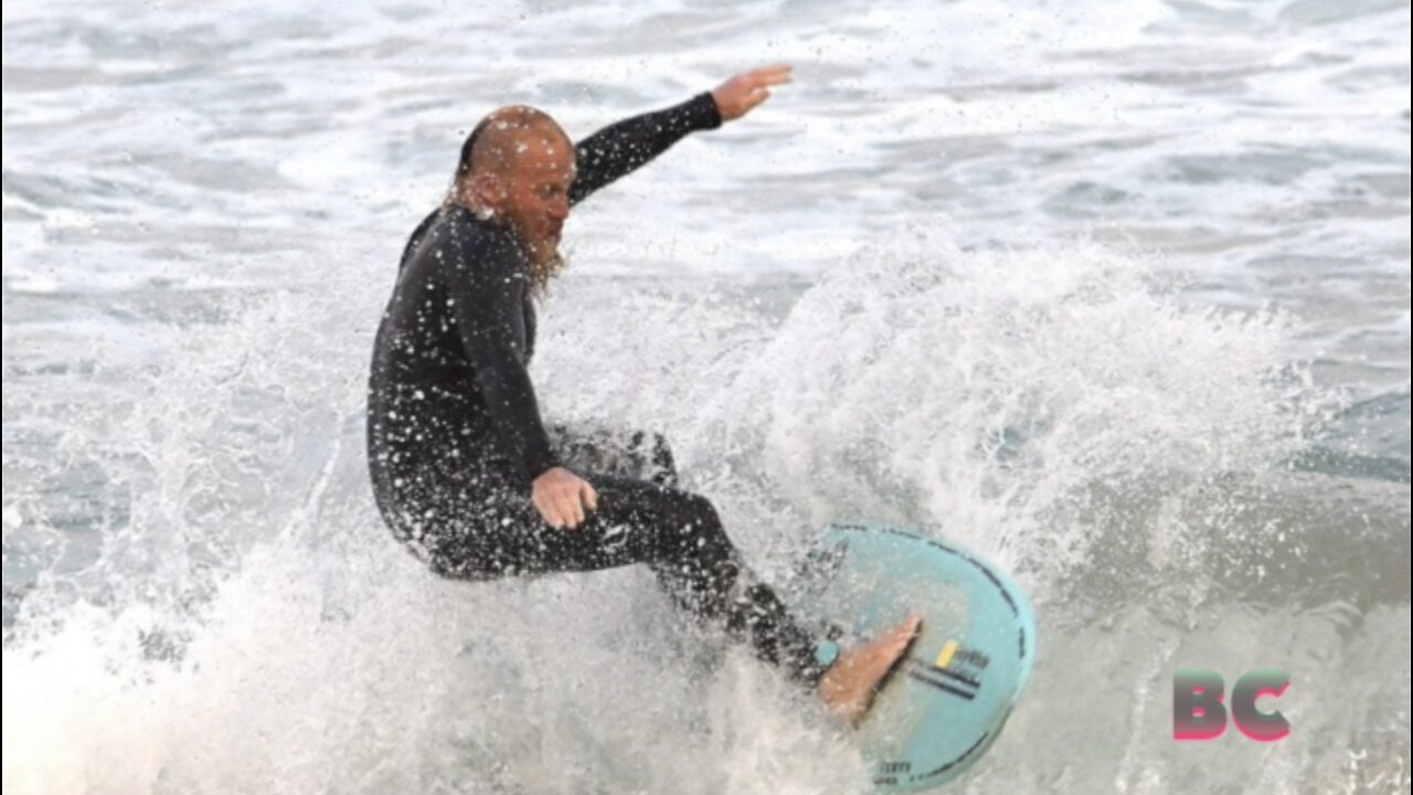 Australian surfs for 40 hours to smash world record