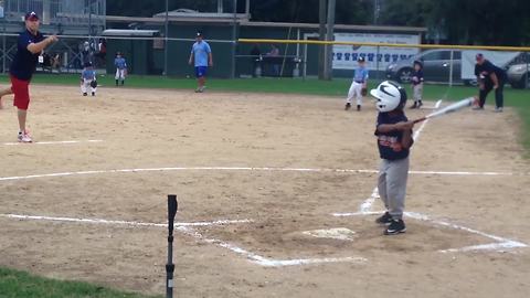 A Tot Boy Falls And Flips Over After Hitting A Tee Ball