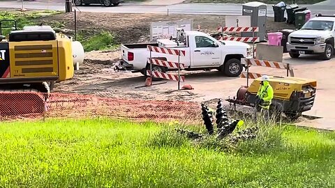 Water mains are hooked up and the dirt compacting has begun. Road construction project.