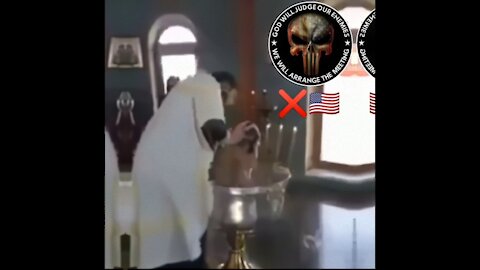 satanic "baptizing" a child!