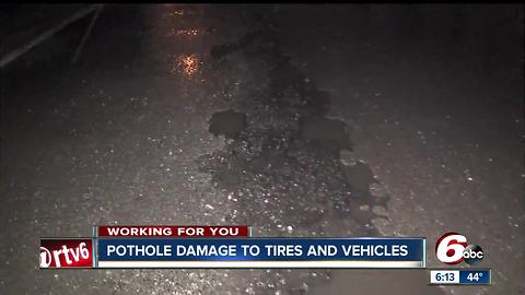 What should you do if you blow out a tire because of a pothole?