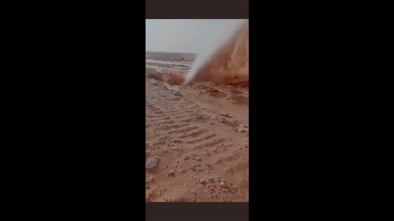 Saudi Arabia, water gushes out of a hole in the middle of the hot desert