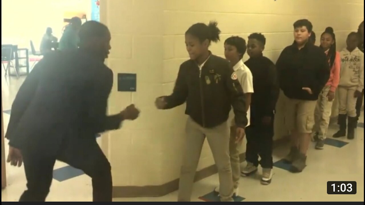 Teacher has incredible handshake with student