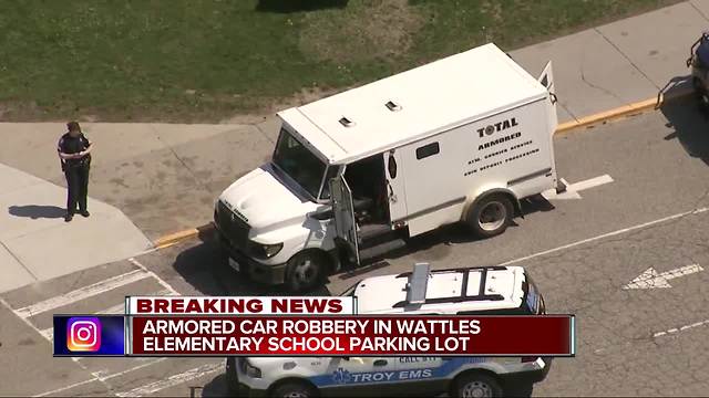 Police investigating armored truck robbery at elementary school in Troy