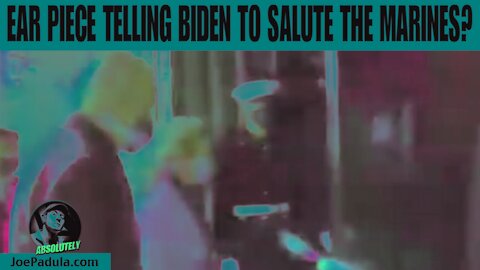 Does Biden have an Ear Piece telling him to Salute the Marines?