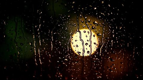 Sleep better with this rain on a roof and window ambience.