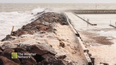 Waves make a foamy mess as they crash over the rocks