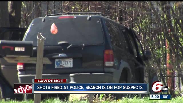 Lawrence police chase suspects following a traffic stop and suspects fired shots at them