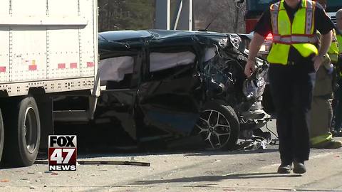 Car rear ends semi, shuts down U.S 127 in Lansing