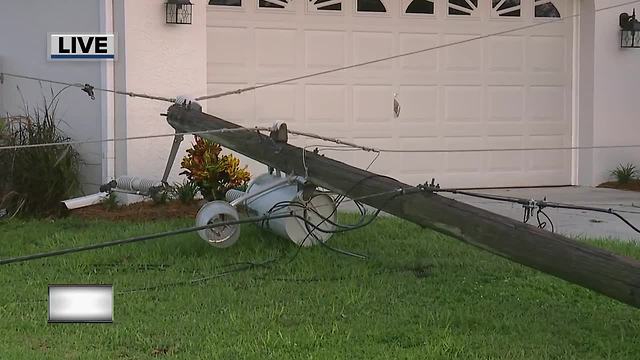 Power lines down across home's driveway in Lehigh Acres