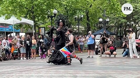 At a pride festival, a transgender person selected kids from the crowd to dance with.