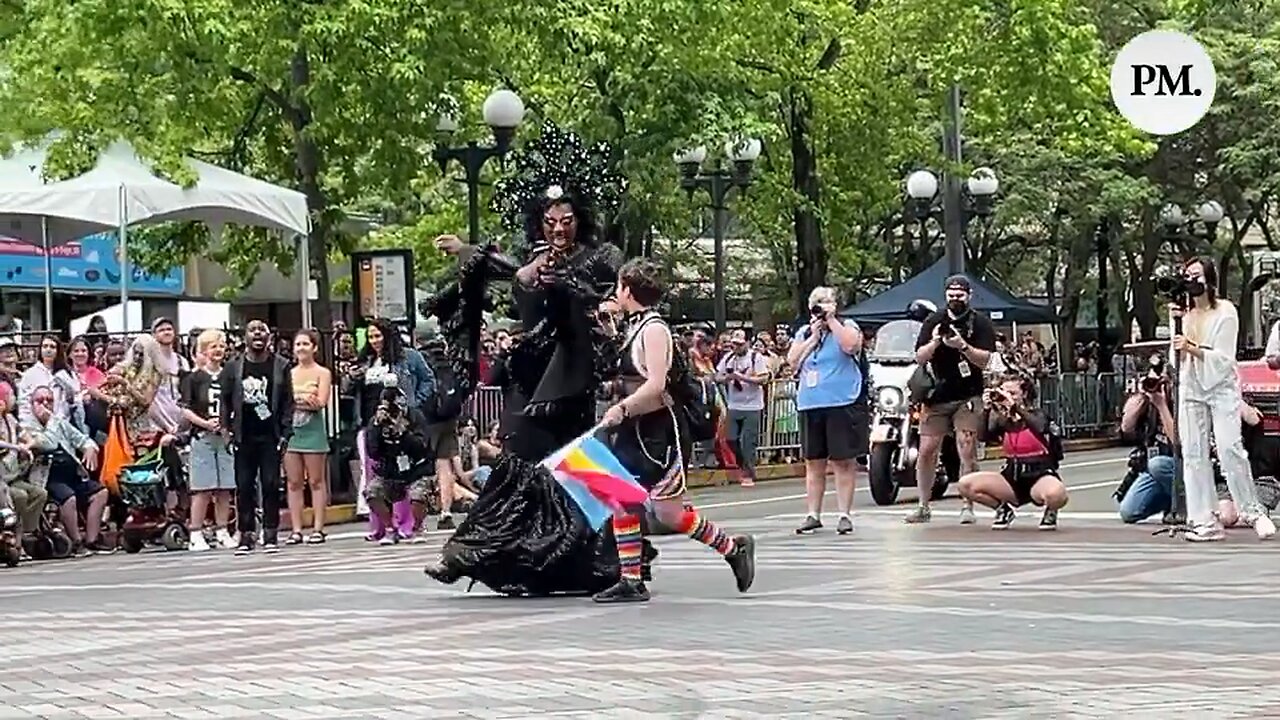 At a pride festival, a transgender person selected kids from the crowd to dance with.