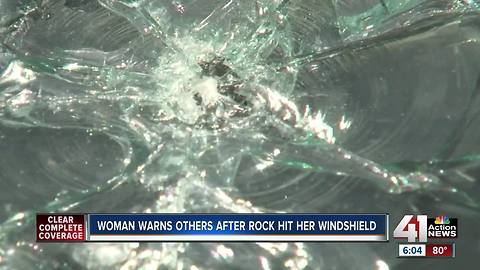 Woman avoids bridge after rock strikes car