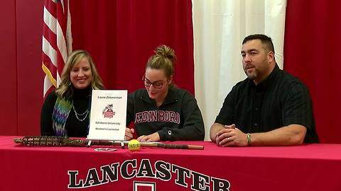 Laura Zimmerman signs scholarship