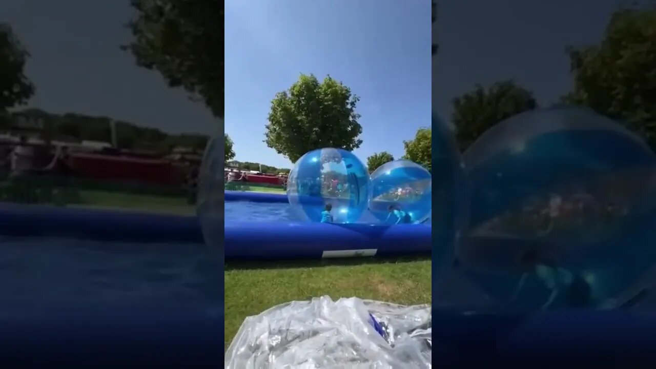 Kid gets blown away 💨 #accident #waterball #amusement
