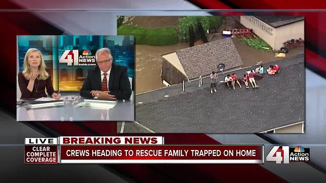 Family of 7 stranded on rooftop in Overland Park