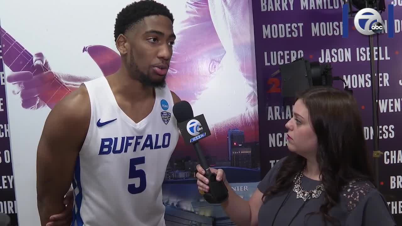 Jenna Callari talks with UB senior CJ Massinburg following the team's first round win over Arizona State