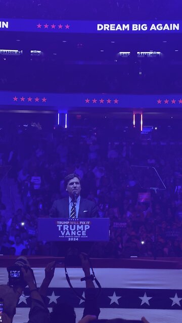 Tucker Carlson makes his entrance at Donald Trump’s MSG Rally