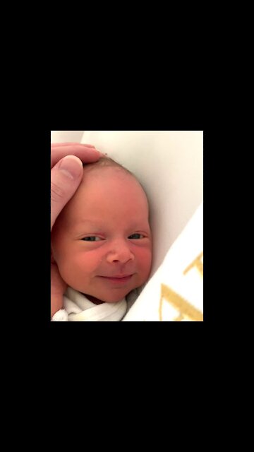 Cute baby reacts to head massage