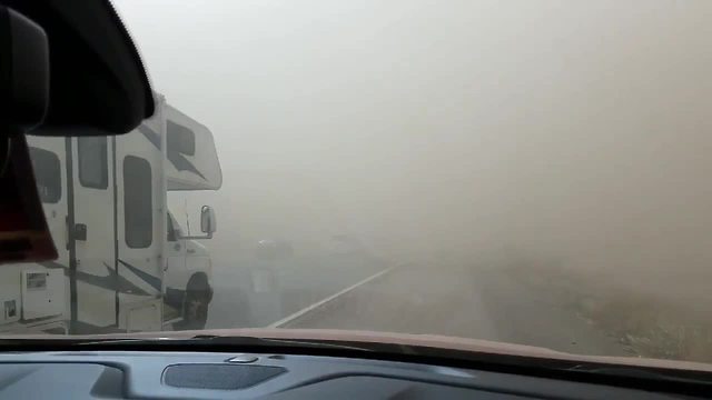 NO VISIBILITY: Cars pull to side of road during dust storm