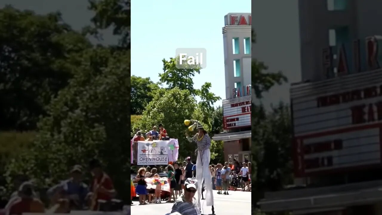 stilt Walker Falls during parade