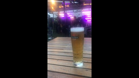 Enjoying a beer with a live band