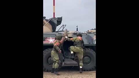 soldiers running to enter moving tanker