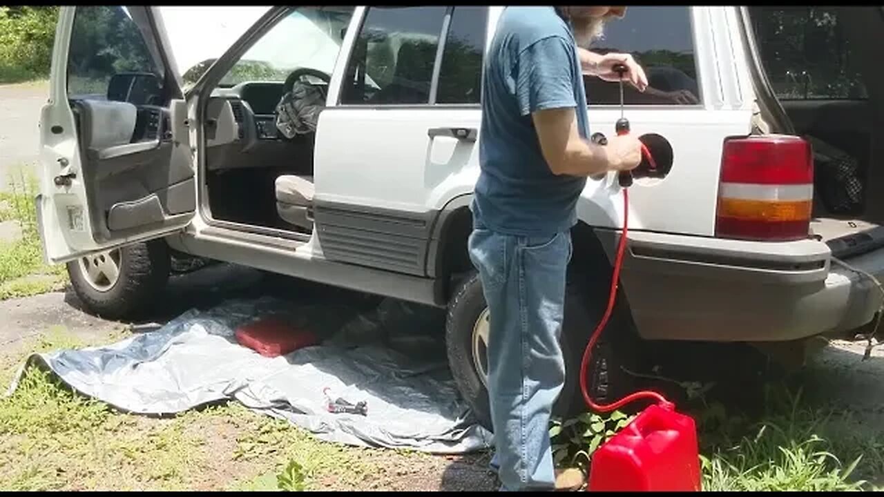 Siphoning the Gas out of our Wrecked Jeep Grand Cherokee using a Harbor Freight Siphon and Can.