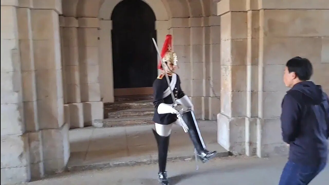 King's guard stamps his foot at tourist trying to get pic on the Change over in the arches