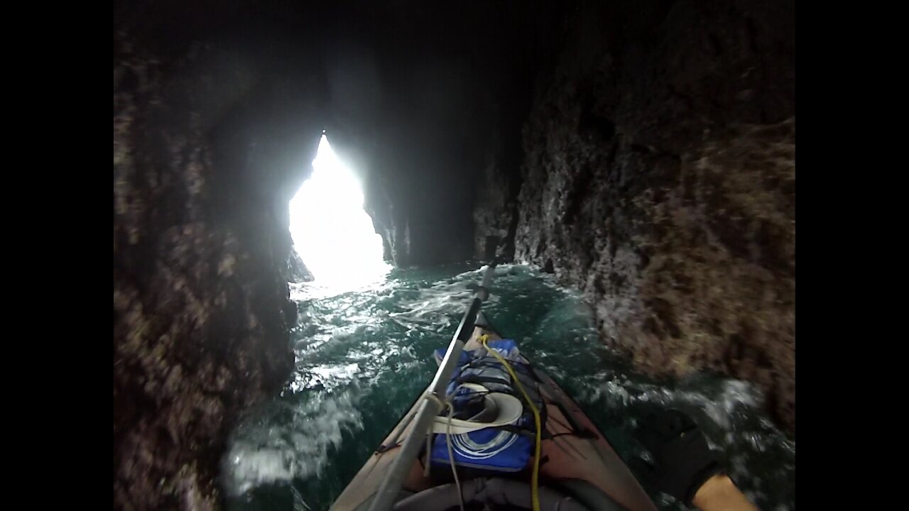 Kayaking through the caves of the Arch Rock