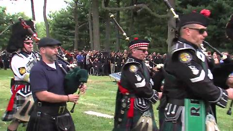 Bagpipes play at the end of Lt. Aaron Allan's funeral