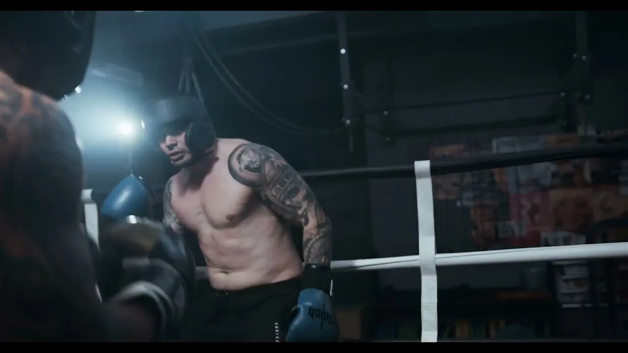 Two Men Spars In A Boxing Match