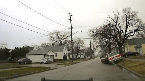 Dash cam video shows a man dragging an officer during a traffic stop