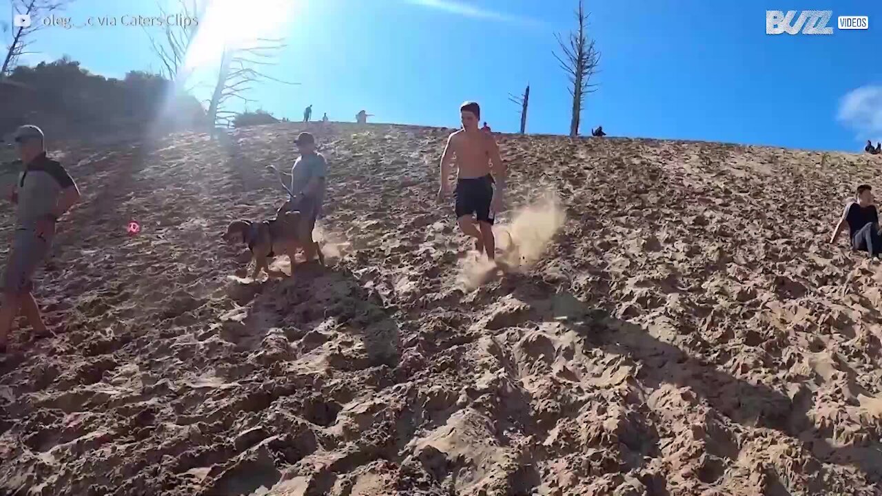 Guy backflips down sand dune at alarming speed 4