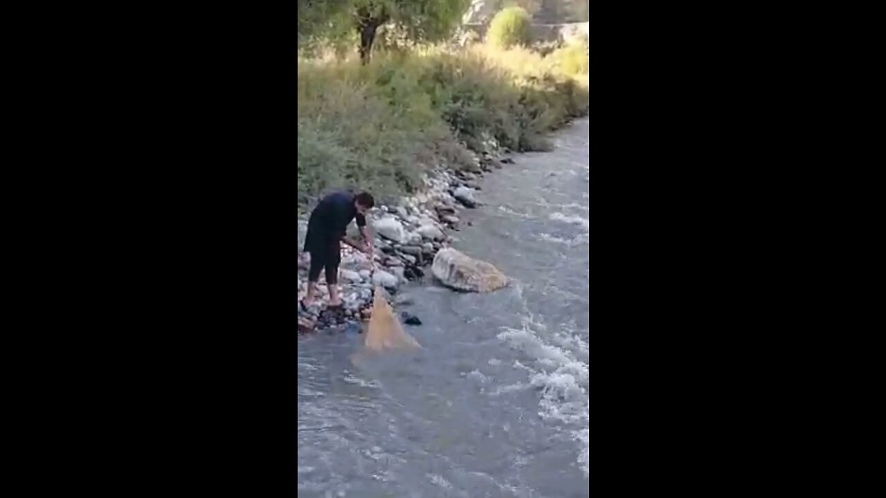 Cast net fishing in river