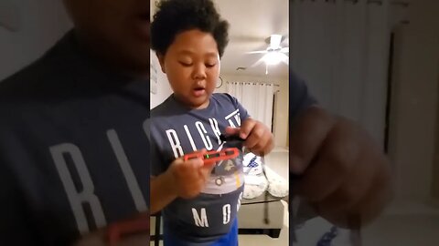 kid shows his Nintendo Switch