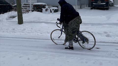 guy on 10 speed bike trying to ride in the snow