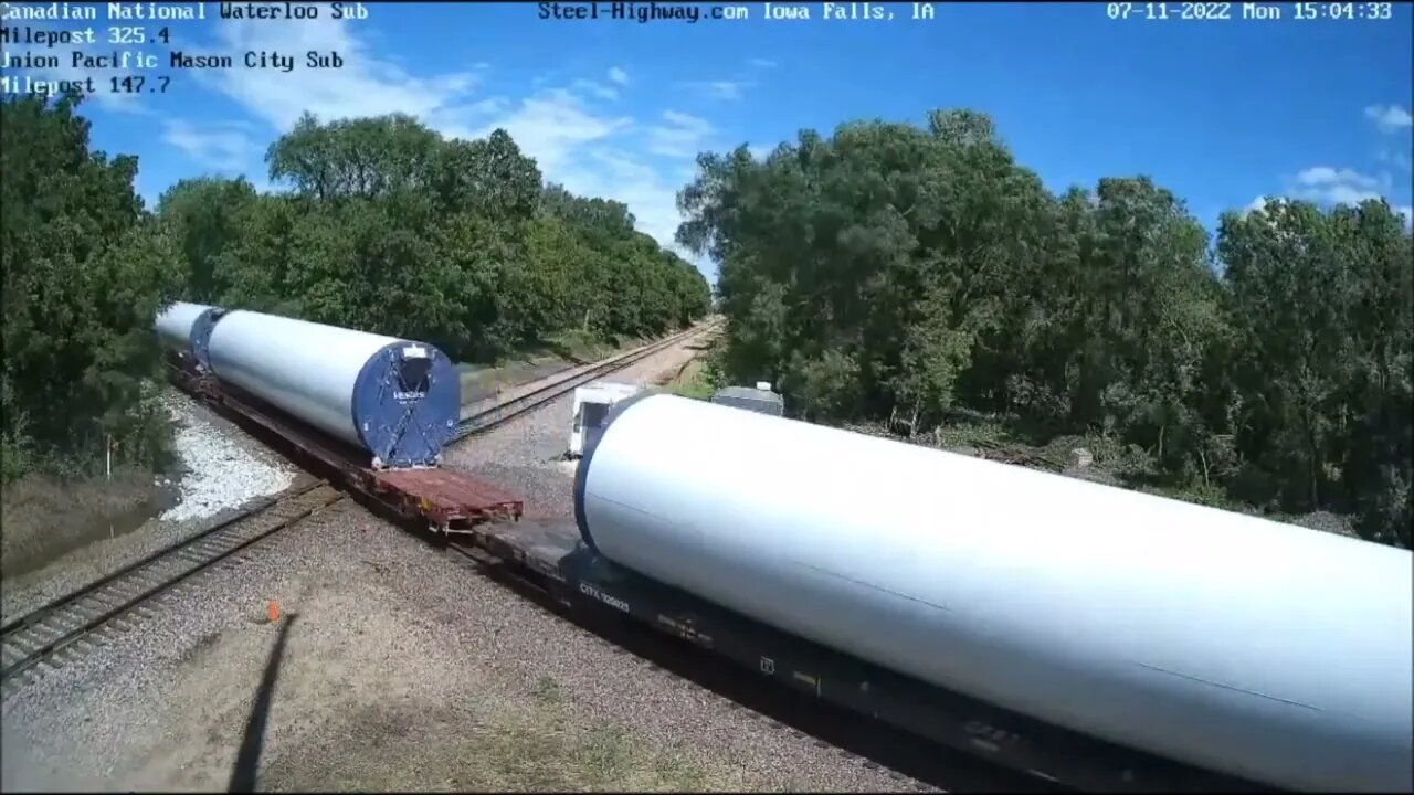 EB then NB UP Wind Turbine Towers at Carroll, IA and Mills Tower in Iowa Falls, IA on July 11, 2022
