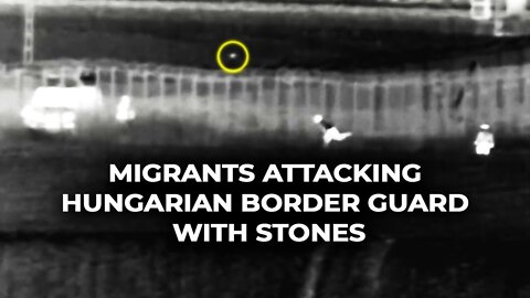 Migrants attacking hungarian border guard