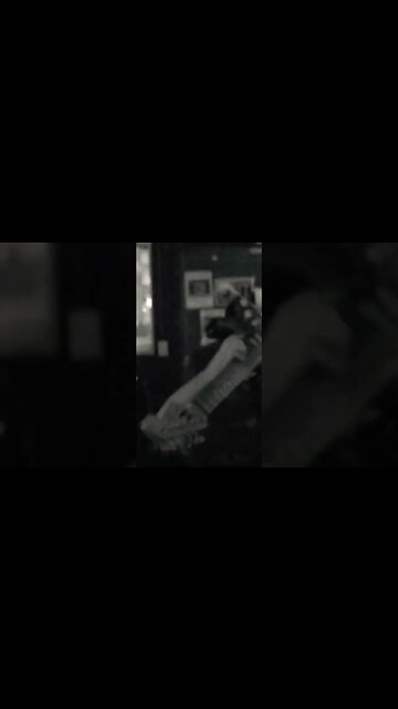 Cari Dell playing guitar behind her head - Jimi Hendrix style