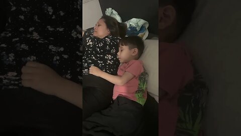 Cute little boy falls asleep beside his mommy-so sweet
