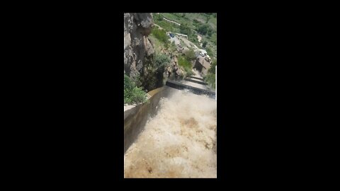 Brave kids exploring dangerous side of hydropower plant.